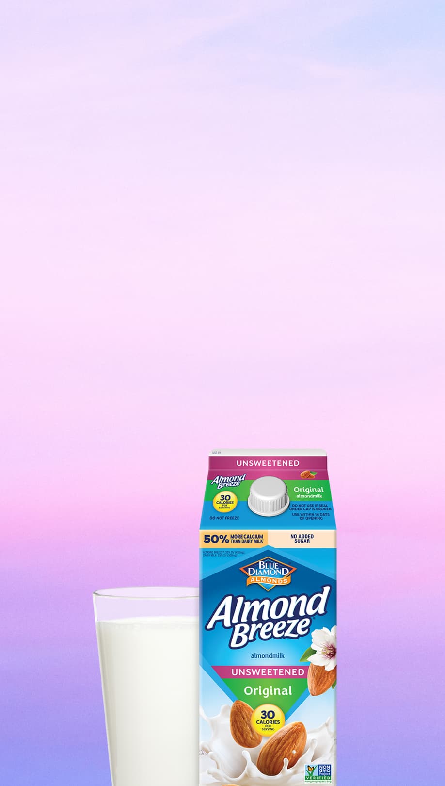 Carton and glass of Almond Breeze almond milk with purple background