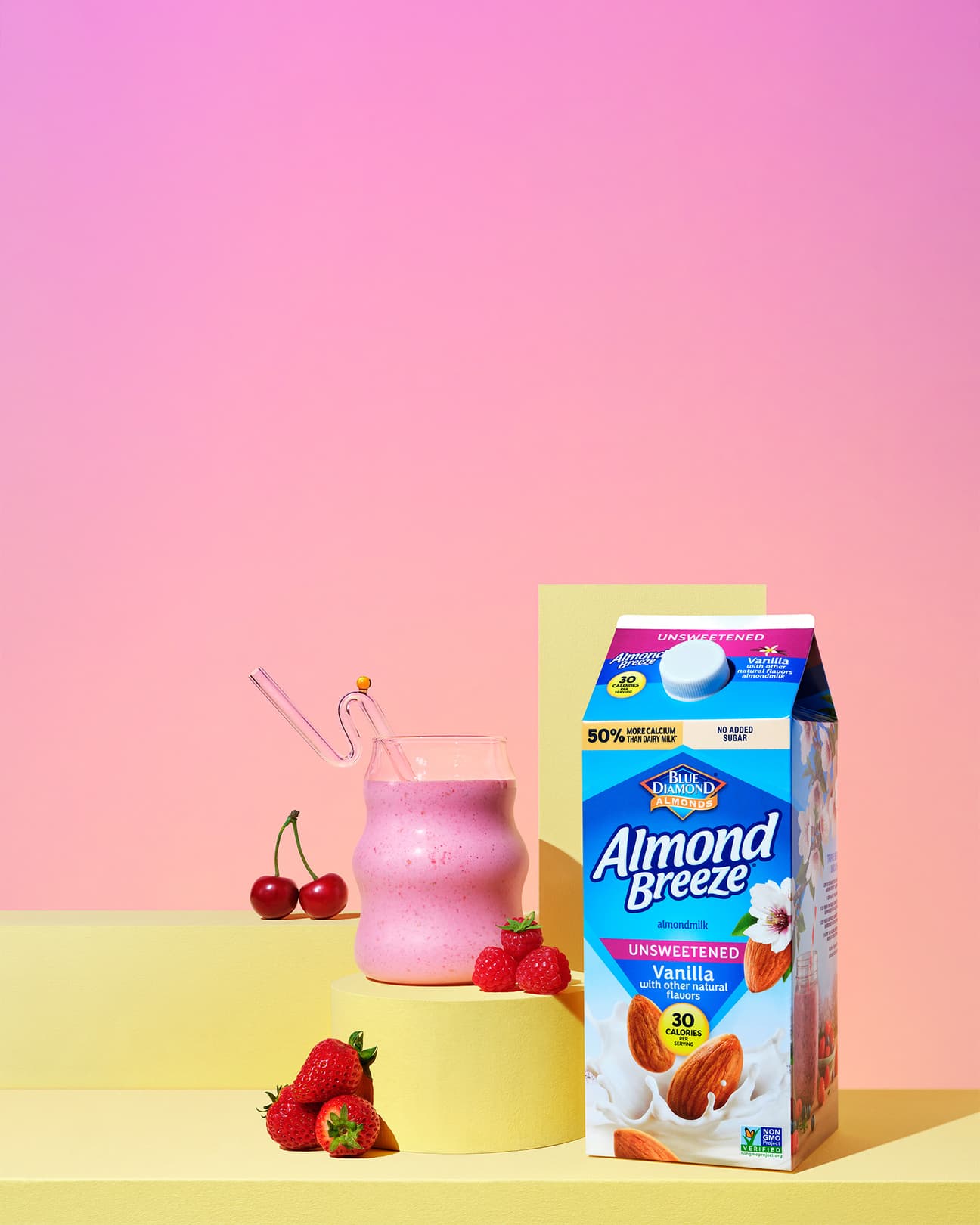 Almond breeze carton next to fruit smoothie