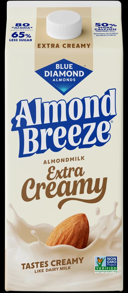 Carton of Blue Diamond Almond Breeze Extra Creamy almondmilk with an almond splashing into a creamy liquid.