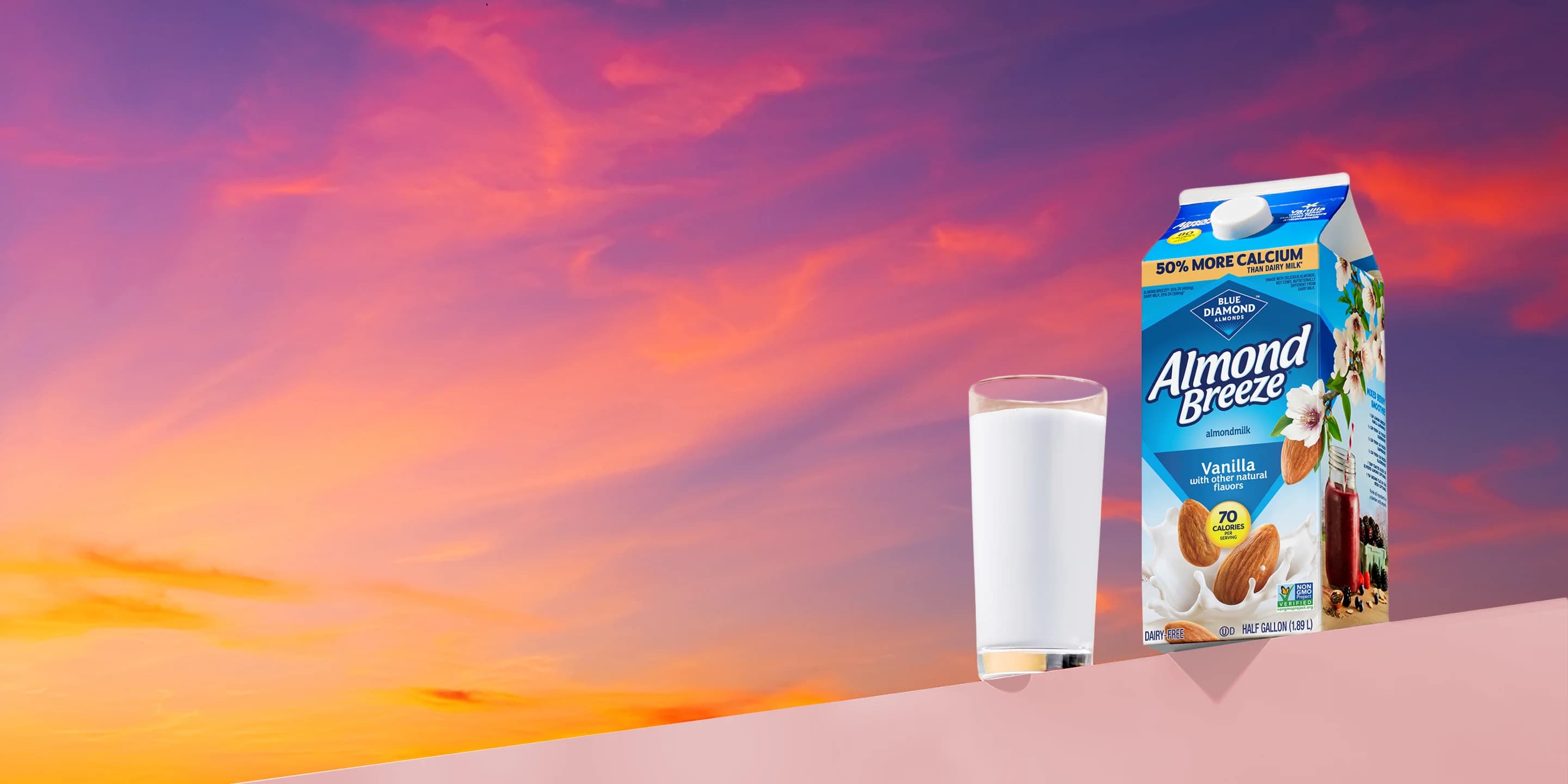 Almond breeze carton next to glass