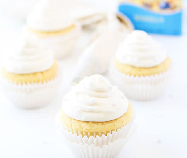 Vanilla almond cupcakes topped with white frosting