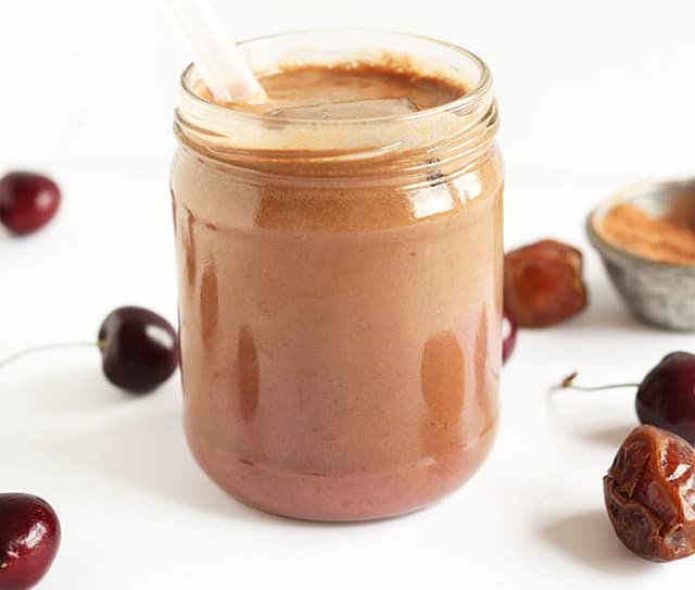 Mason jar full of dairy-free chocolate cherry almond milk milkshake