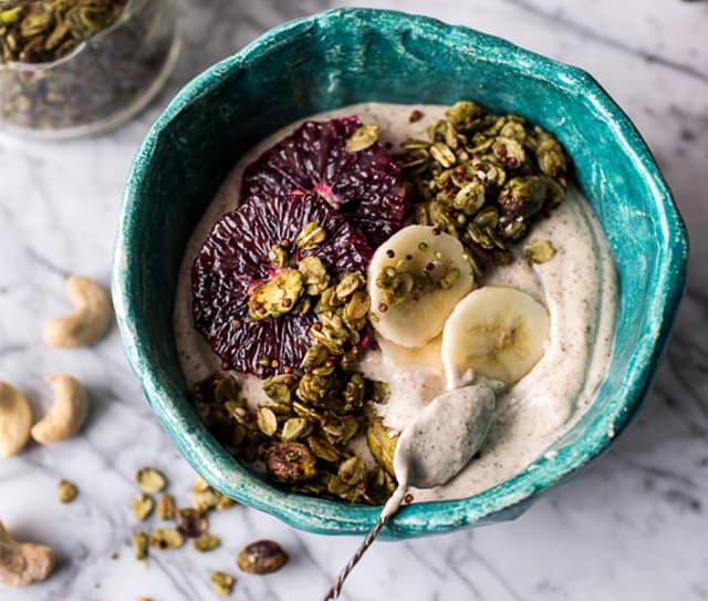 Bowl of yogurt topped with cashews and Blue Diamond Almonds