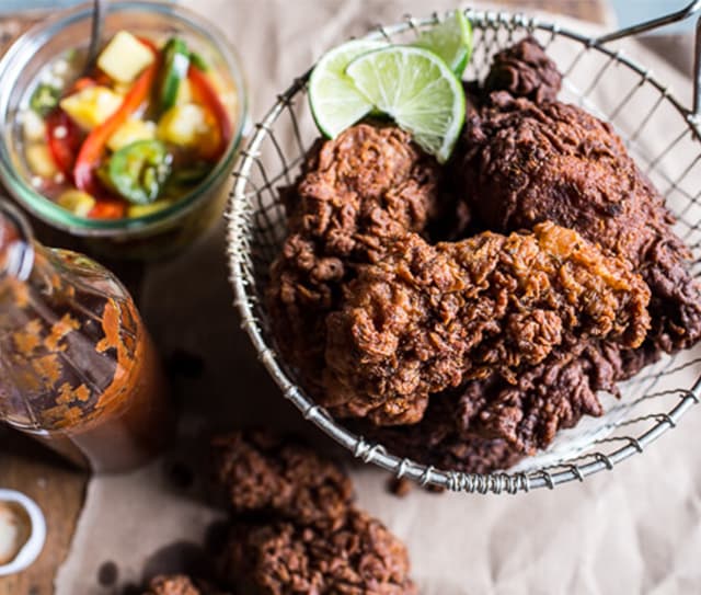 Almond buttermilk jamaican fried chicken with rum pickled and pineapple slaw