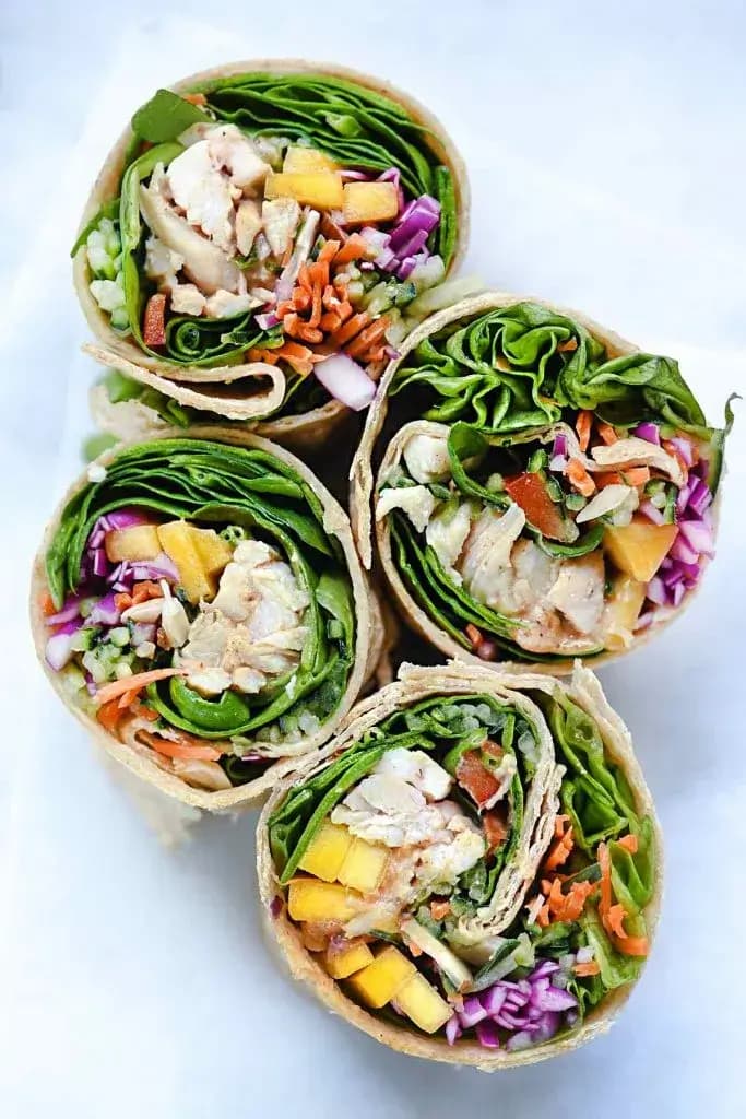 Four chicken and mango rainbow veggie wraps