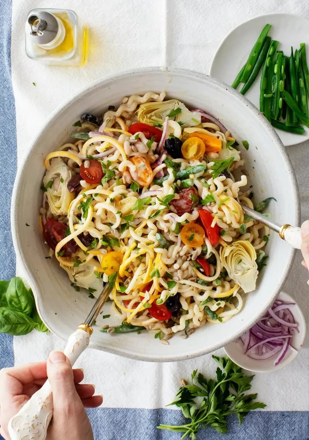 Serving bowl full of sunny creamy tahini pasta salad