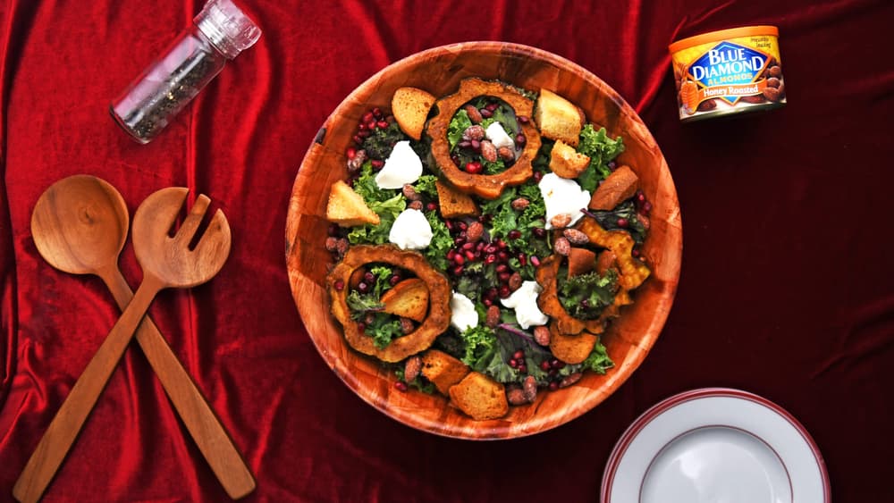 Bowl full of harvest squash salad topped with Blue Diamond Honey Roasted Almonds