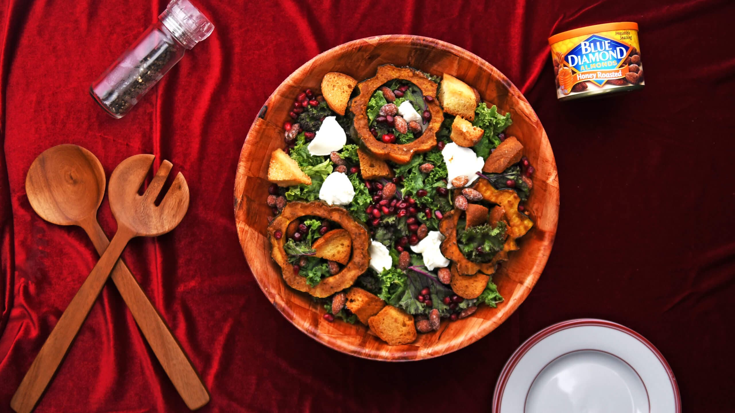 Bowl full of harvest squash salad topped with Blue Diamond Honey Roasted Almonds