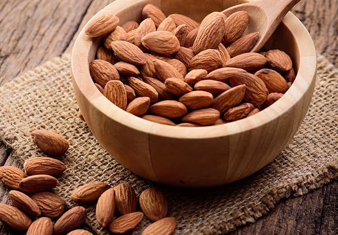 Bowl of snack almonds on a table