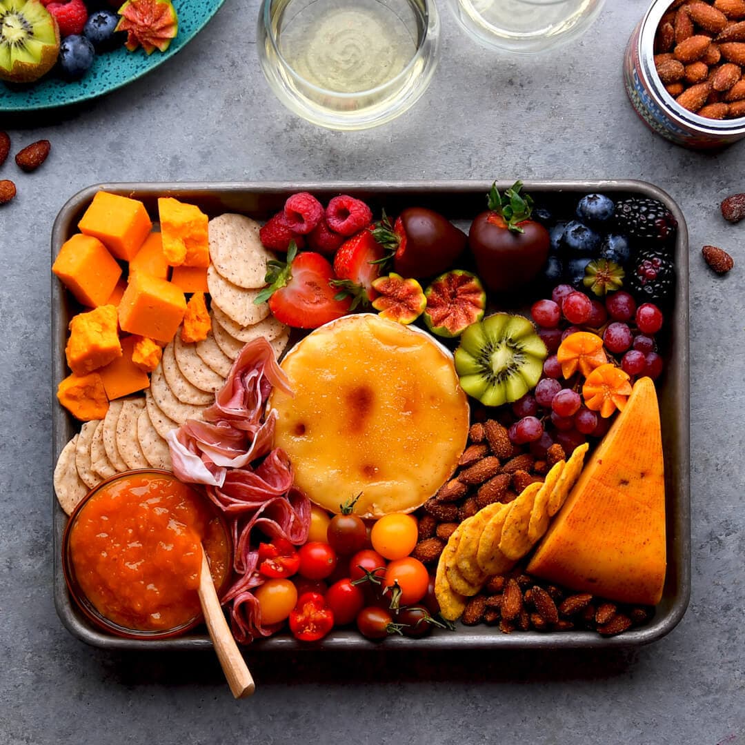 Charcuterie board full of fruits, cheeses,and Blue Diamond Almonds