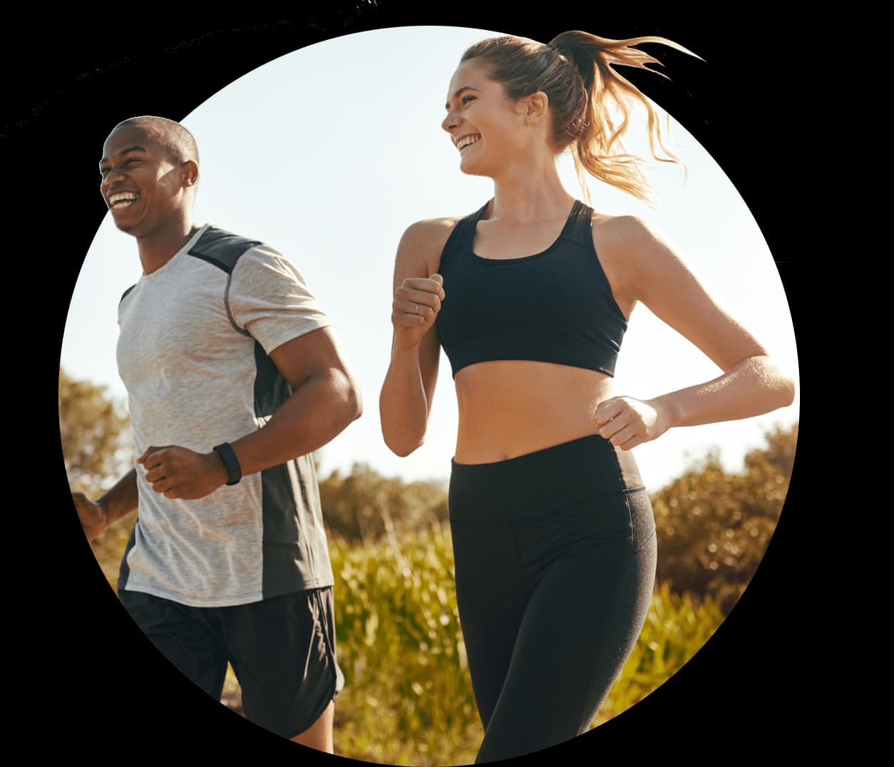 People jogging outside along a tail.