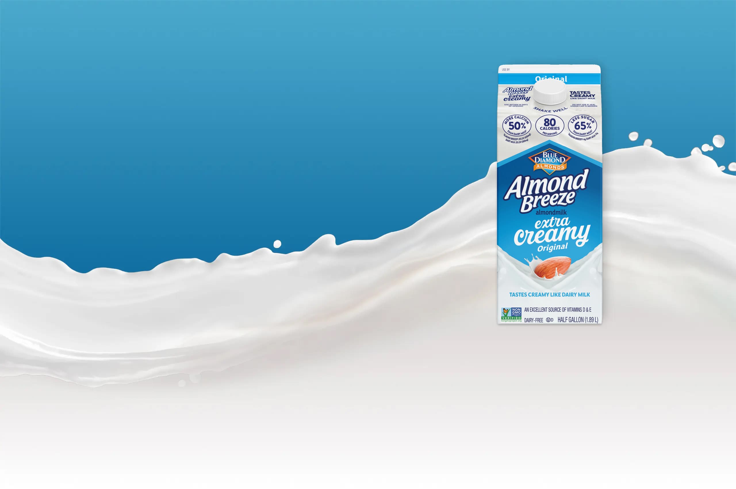 Extra Creamy Original Almondmilk in front of a splashing wave of milk.