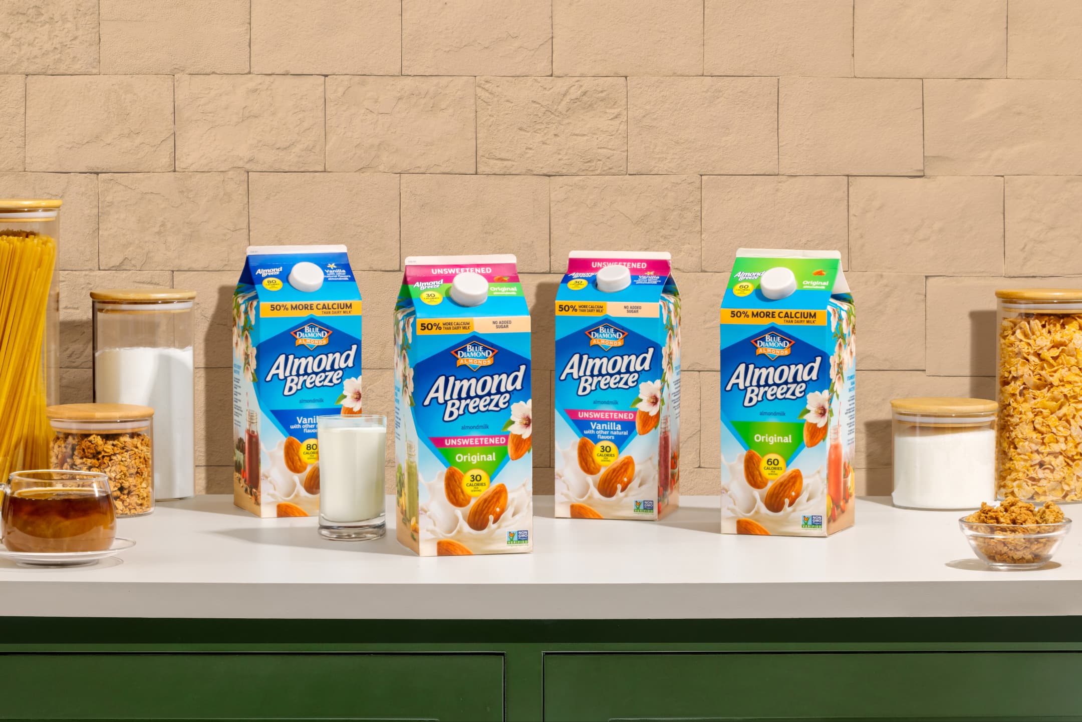 Almond Breeze almondmilk cartons lined up on a countertop.