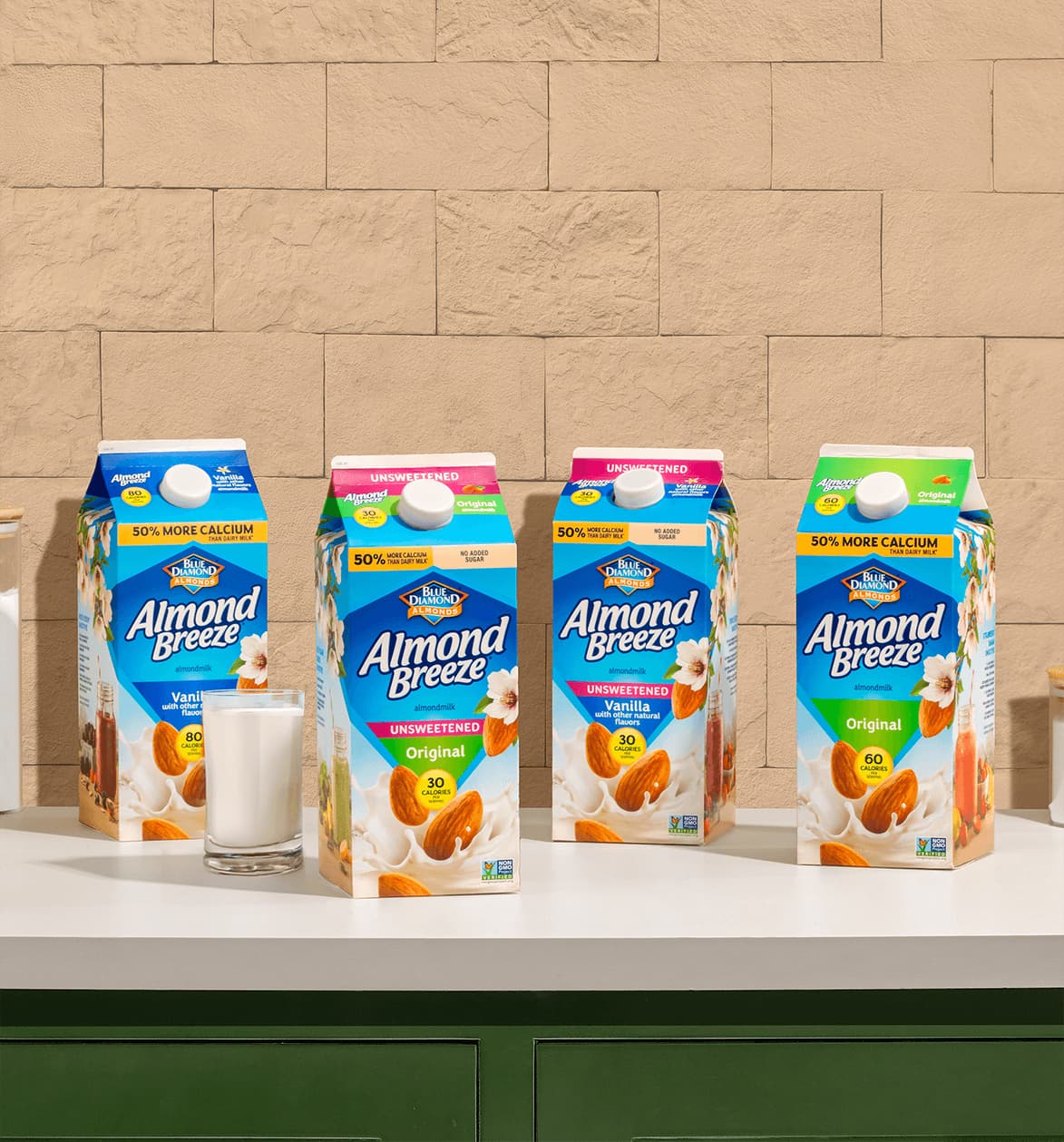 Almond Breeze almondmilk cartons lined up on a countertop.