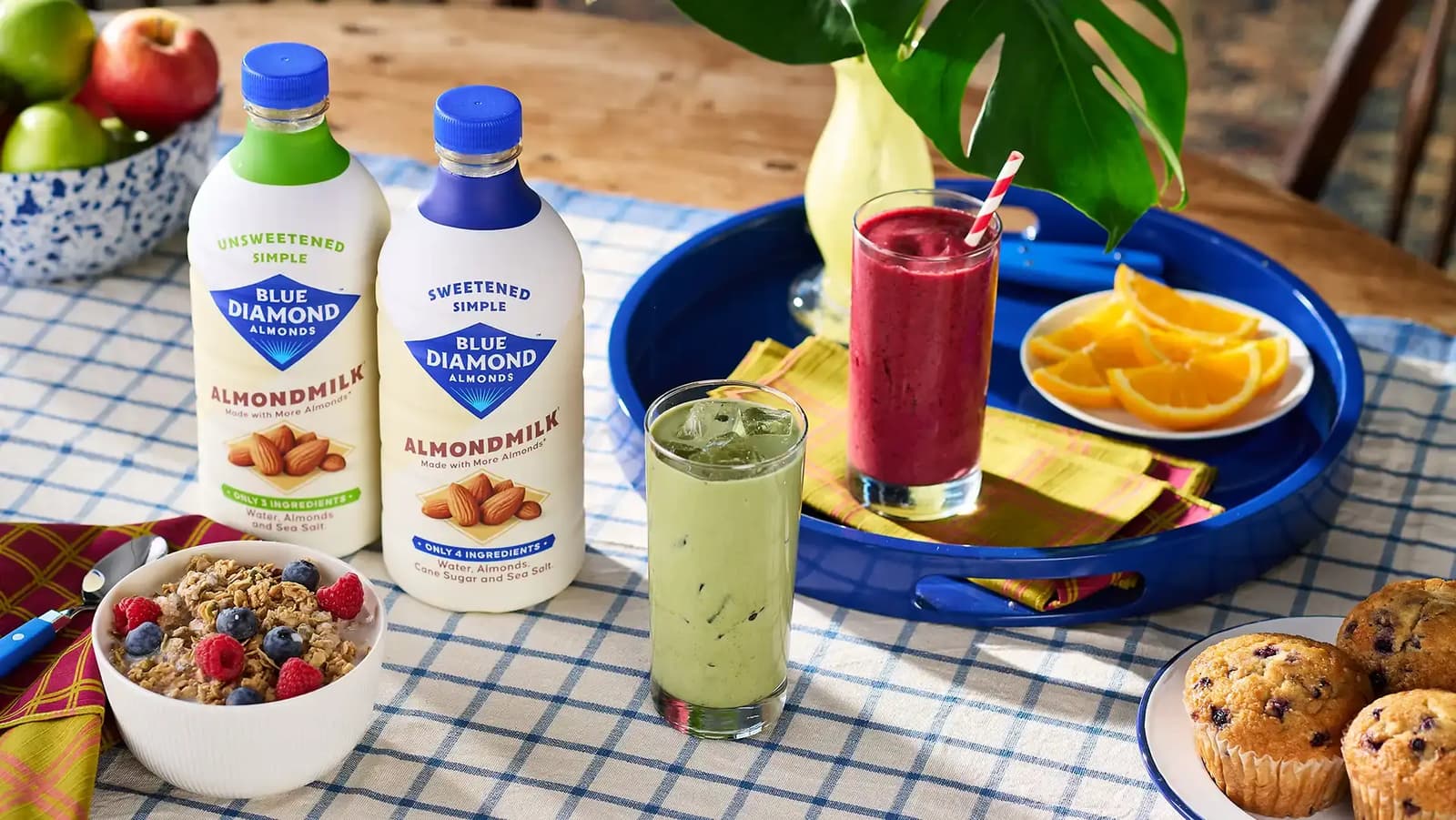 Simple ingredients almondmilk products on table surrounded by other foods