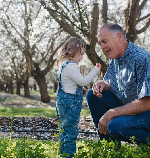 Adult and child looking at an almond